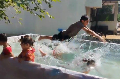 Adana’da sıcaklar rekor kırdı! Vatandaş traktör römorkunu çocuklar için havuz yaptı