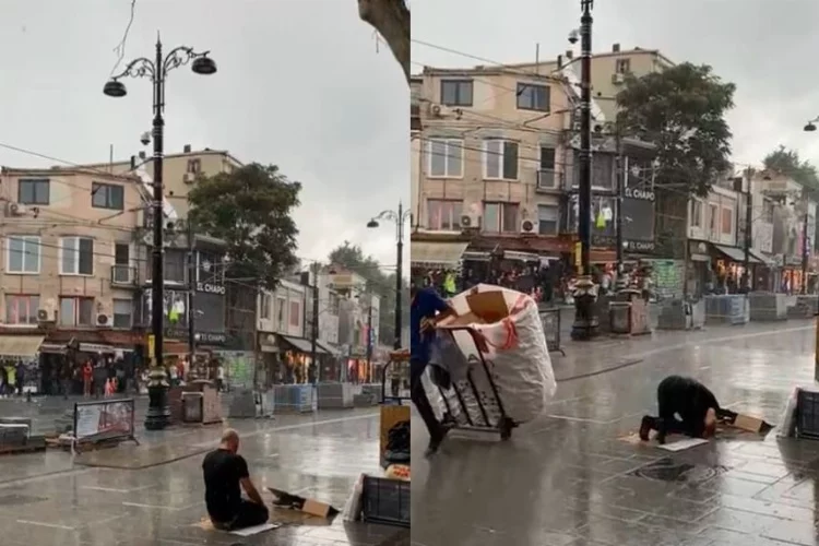 Fatih’te bir vatandaş sağanak yağmur altında namaz kıldı
